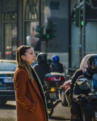 Women standing on street in city