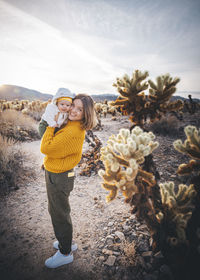 Portrait of young woman standing outdoors