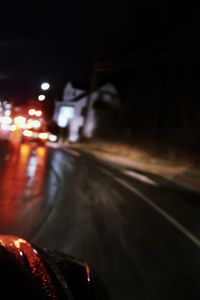 Cars on road in city at night