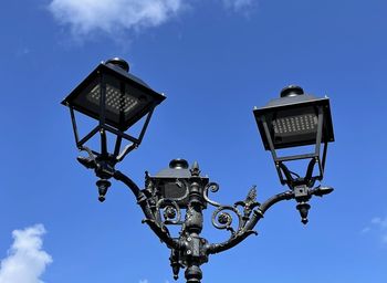 Low angle view of street light against sky