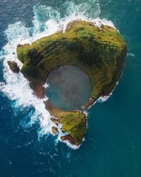 High angle view of surf on sea shore