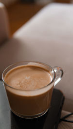 Close-up of cappuccino on table