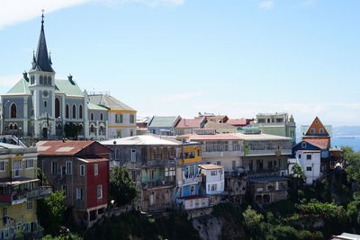 Buildings by cathedrals against sky