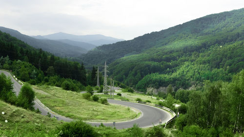 High angle view of winding road on mountain against sky