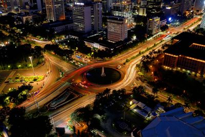 High angle view of illuminated buildings in city at night