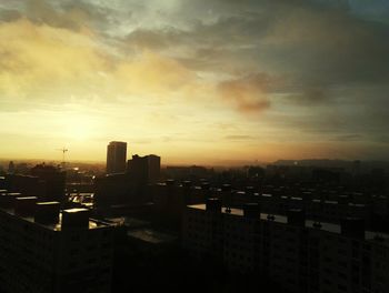 High angle view of buildings against sky during sunset