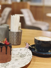 Close-up of coffee cup on table