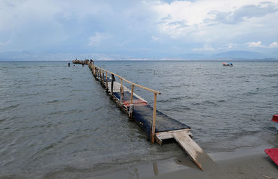 Pier over sea against sky