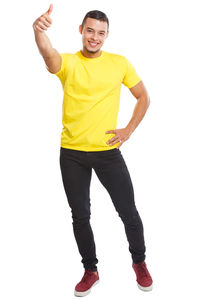 Portrait of young man standing against white background