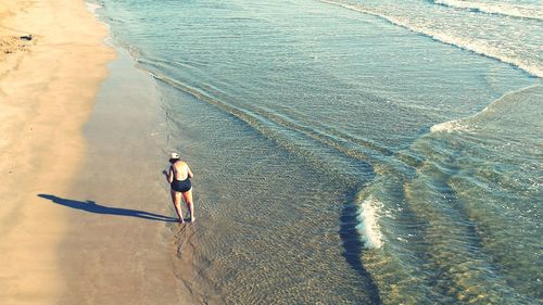 Woman standing on beach