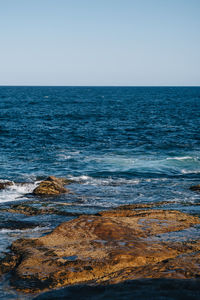 Scenic view of sea against clear sky