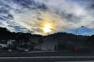 View of road against cloudy sky