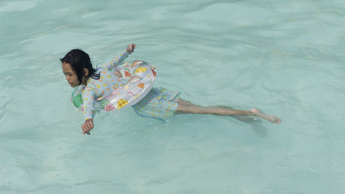 Portraits of asian girl wearing a swimsuit. swimming in the pool