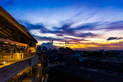 High angle view of buildings against sky during sunset