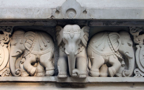 Close-up of carvings on wall at birla mandir