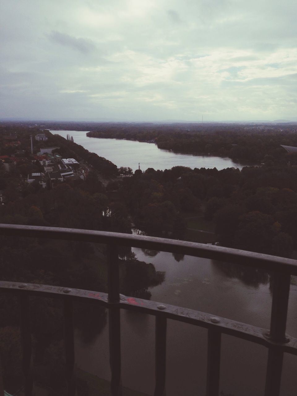 water, sky, cloud - sky, railing, built structure, river, architecture, bridge - man made structure, transportation, cloud, reflection, lake, high angle view, nature, cloudy, connection, building exterior, no people, tree, day