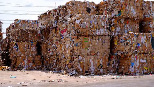 Garbage on metal structure against sky