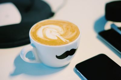 Directly above shot of coffee cup on table