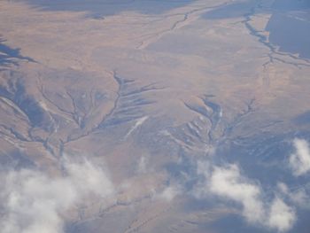Aerial view of snowcapped mountain against sky