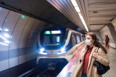Full length portrait of woman in bus