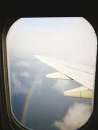 Aerial view of clouds seen through airplane window