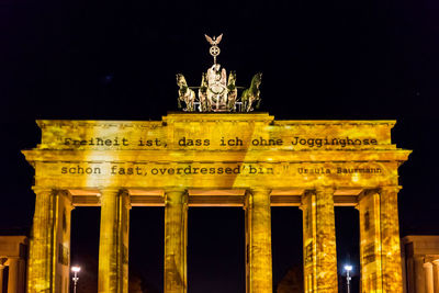 Low angle view of statue at night