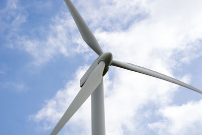Low angle view of wind turbine against sky