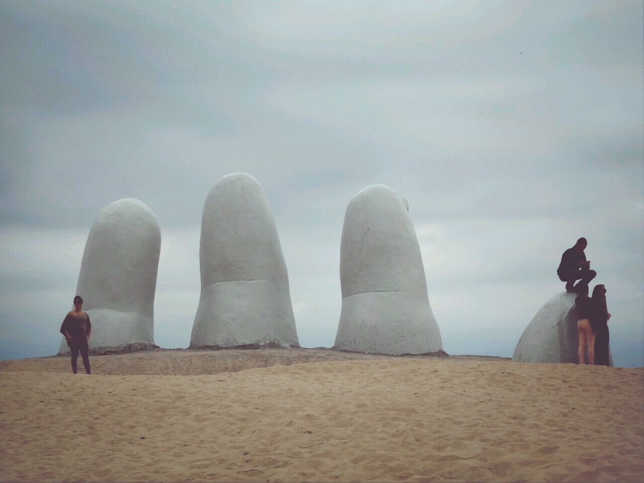 men, sky, rear view, beach, standing, leisure activity, lifestyles, person, day, art and craft, water, sand, human representation, cloud - sky, outdoors, focus on foreground, sculpture