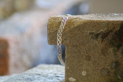Close-up of rope tied on rock