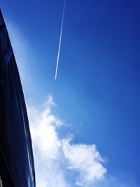 Low angle view of vapor trails in sky