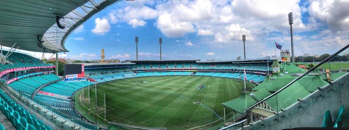 High angle view of empty stadium against cloudy sky