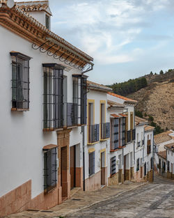 A picturesque narrow of a white downtown antequera in andalusia, spain