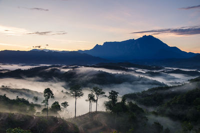 Scenic view of mountains against sky during sunset