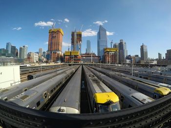 Panoramen view of city with trains against sky