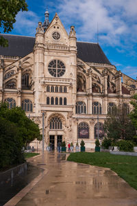 Facade of historic building against sky