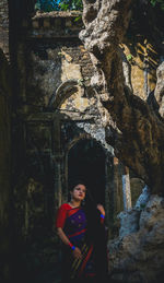 Young woman in traditional clothing looking away