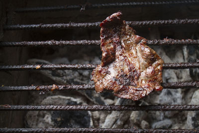 Close-up of meat on barbecue grill