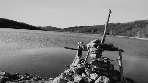 Stack of stones against lake