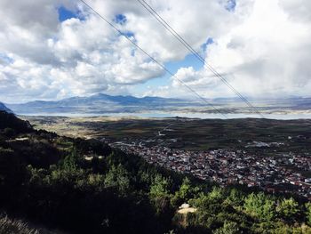 Scenic view of landscape against cloudy sky