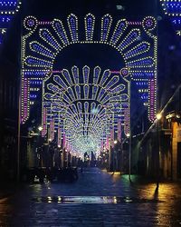 Illuminated buildings in city at night