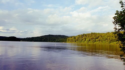 Scenic view of lake and mountains against sky