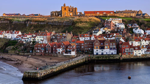 Whitby abbey stands proud over the old town.