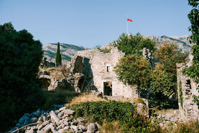 Low angle view of castle on building against sky