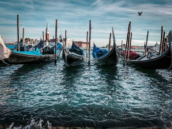 Boats moored in sea
