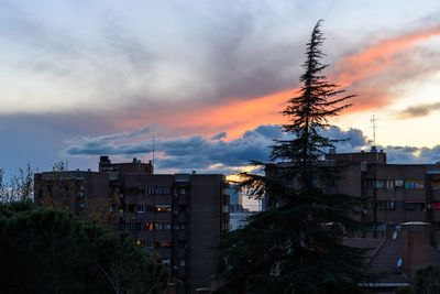 Buildings against sky during sunset