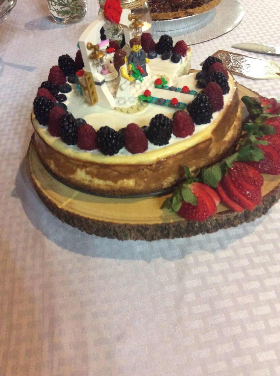 HIGH ANGLE VIEW OF CAKE WITH FRUITS ON TABLE