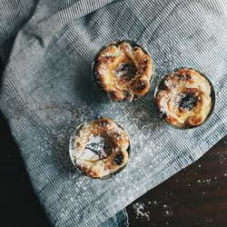 Close-up of cream puffs on napkin