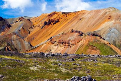 Scenic view of landscape and mountains against sky