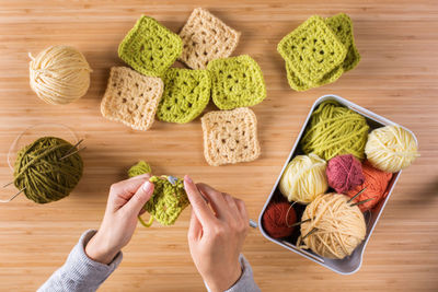 High angle view of woman preparing food on table