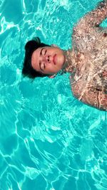 High angle view of woman swimming in pool